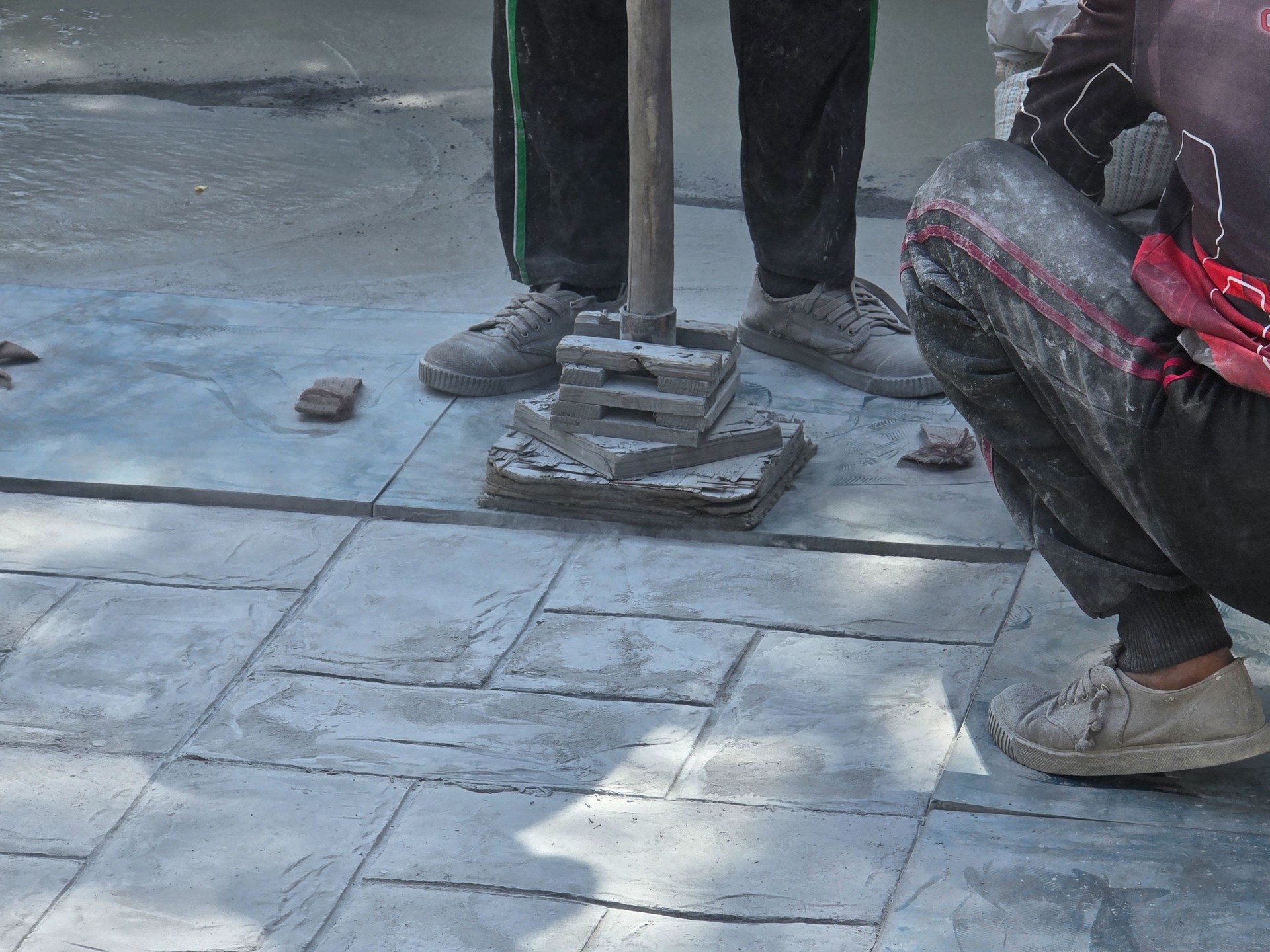 Artisans craft stunning stamped concrete flooring in Pattaya, Thailand